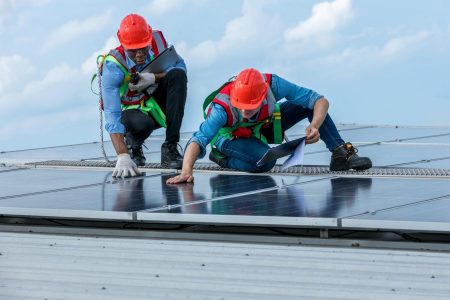 Engineer working setup Solar panel at the roof top. Engineer or worker work on solar panels or solar